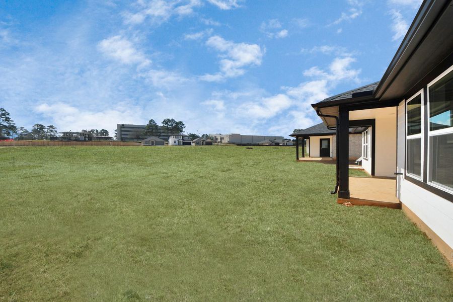 Exterior details and patio area of a home in Montgomery Ridge: Landmark Collection, Montgomery (Image 3).