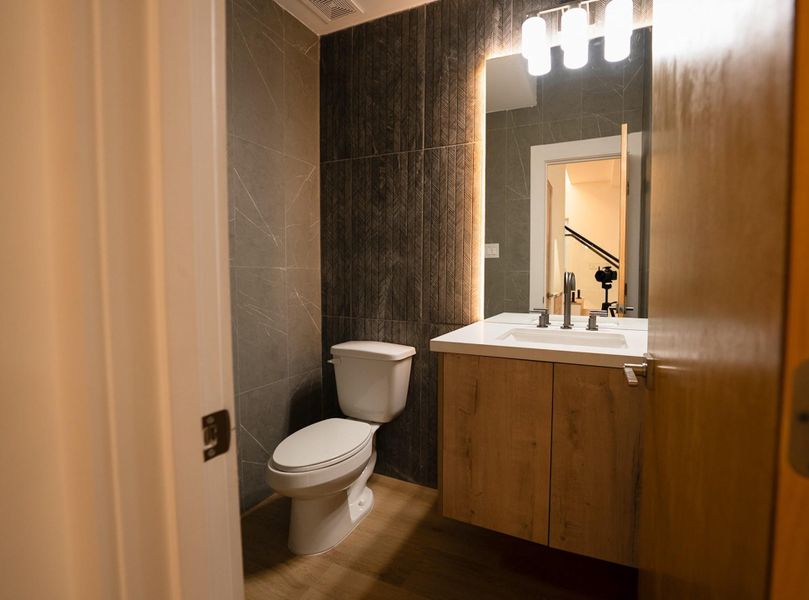 Powder room down — guests never go upstairs Powder room down — guests never go upstairs