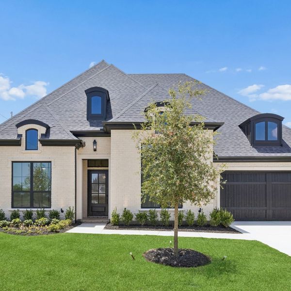 Front exterior of a new home in The Parks at Wilson Creek, Celina, TX, highlighting curb appeal (Image 25). Front exterior of a new home in The Parks at Wilson Creek, Celina, TX, highlighting curb appeal (Image 25).