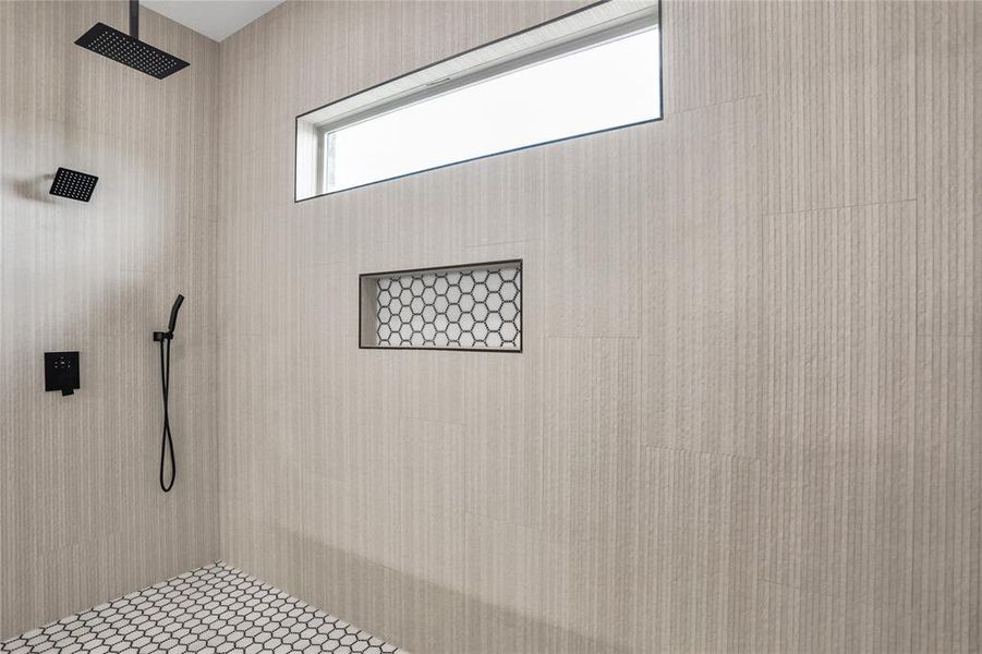 Full bathroom featuring tiled shower Full bathroom featuring tiled shower