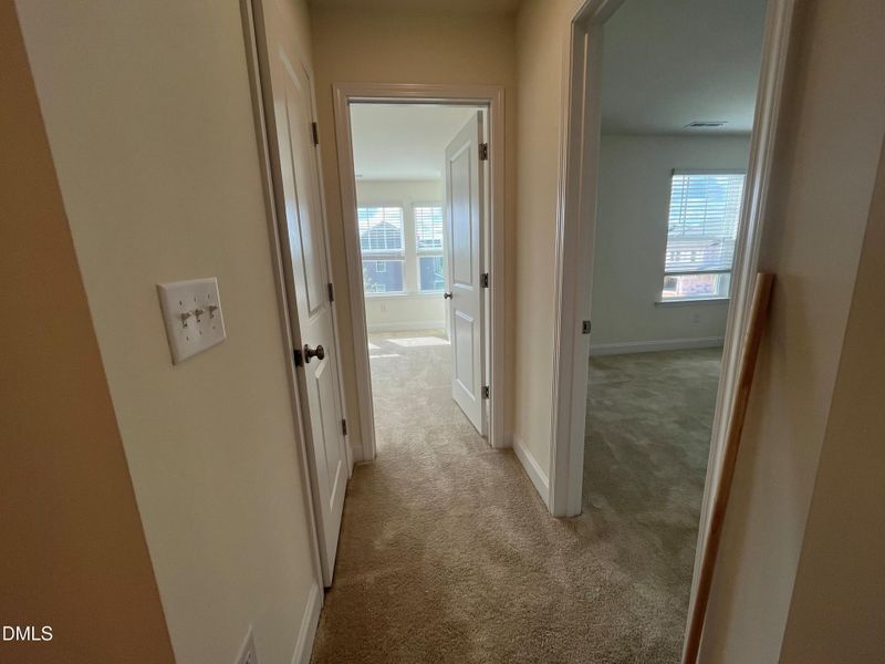 Hallway leading into secondary bedrooms