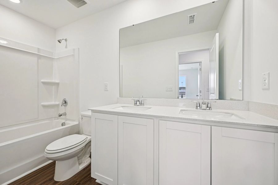 Bath 2 - Stylish finishes and dramatic contrast throughout.