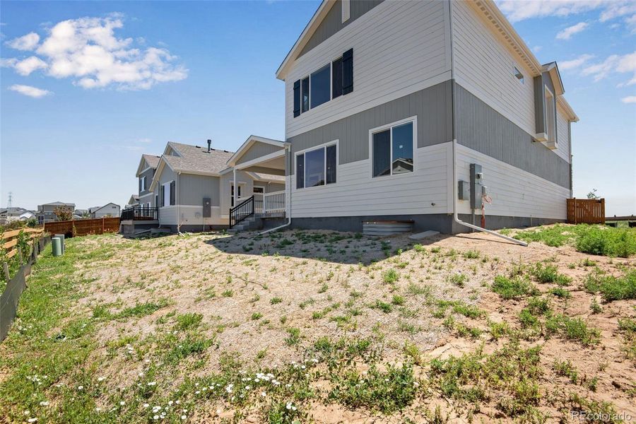 Front exterior of a new home in Reunion Ridge, Commerce City, CO, highlighting curb appeal (Image 23).