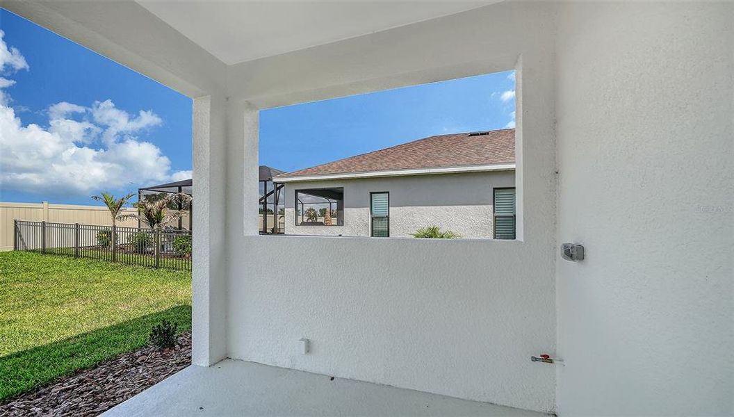 Exterior details and patio area of a home in Canoe Creek, Parrish (Image 3).