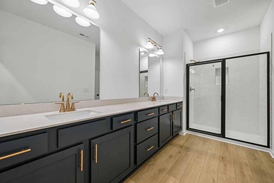 Primary Bath featuring the AW Collection® Sapphire - Clean white and cool hues define the space. Primary Bath featuring the AW Collection® Sapphire - Clean white and cool hues define the space.