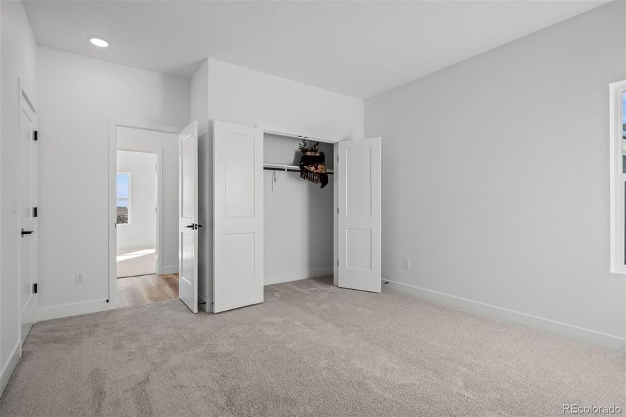 Spacious, unfurnished interior of a new home in Revel Crossing at Wolf Ranch - The Panorama Collection, Colorado Springs (Image 33).