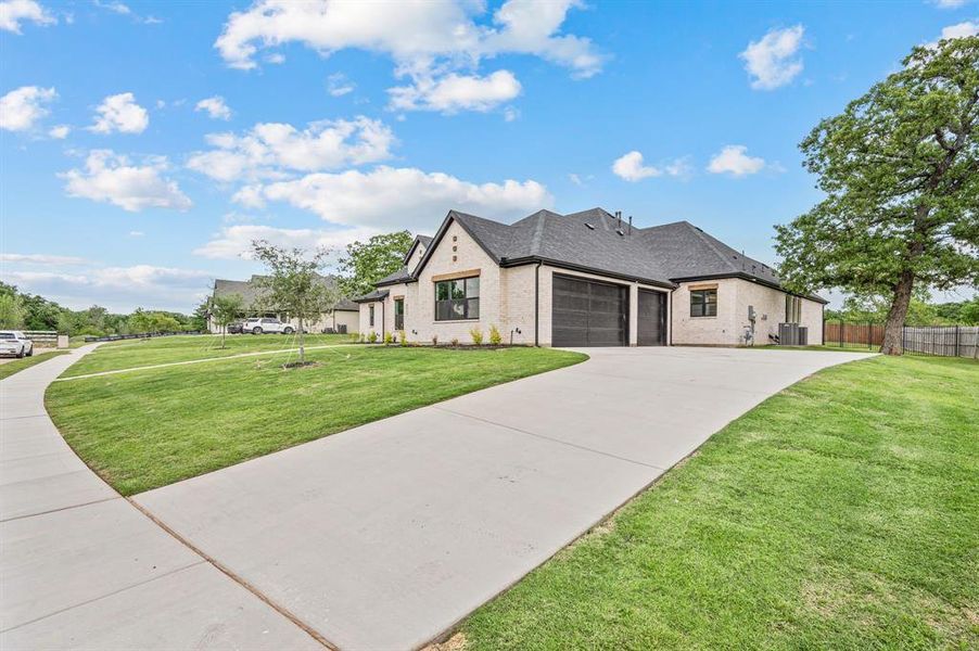 Front exterior of a new home in Highland Oaks, Boyd, TX, highlighting curb appeal (Image 26).