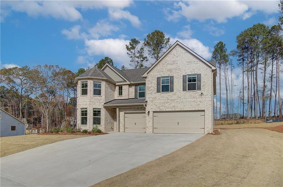 Front exterior of a new home in Camp Creek Village, Atlanta, GA, highlighting curb appeal (Image 20).