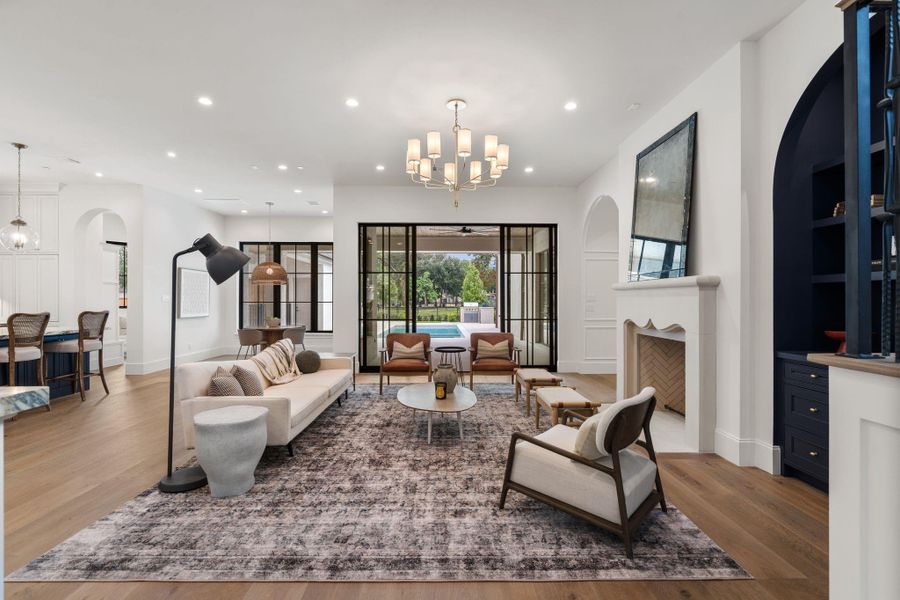 The living room overlooks the porch and pool