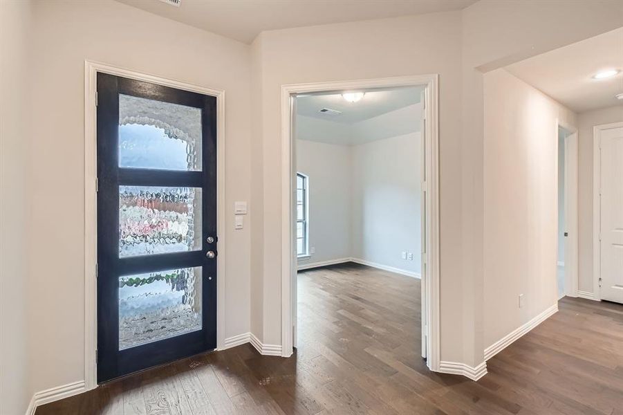 Entrance foyer featuring dark hardwood / wood-style flooring