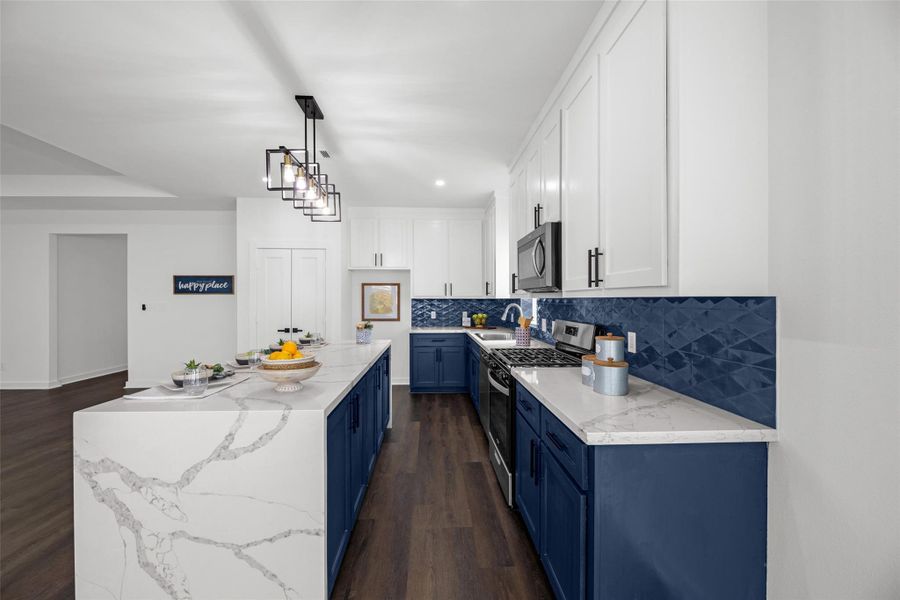 Stainless steel appliances and a central island with pendant lighting complete the look. The space is open and bright, perfect for cooking and entertaining. Stainless steel appliances and a central island with pendant lighting complete the look. The space is open and bright, perfect for cooking and entertaining.