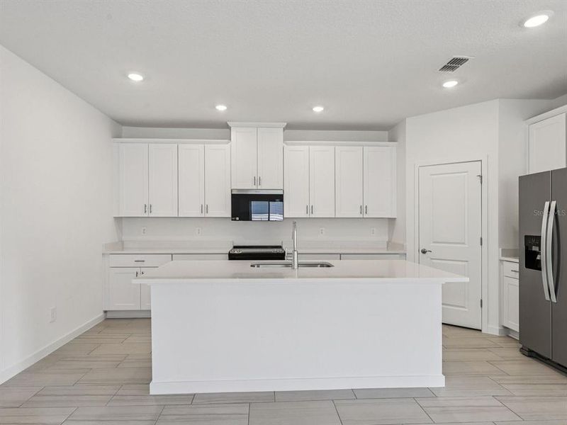 Furnished interior view inside a new home in Colbert Landings, Palm Coast (Image 3).