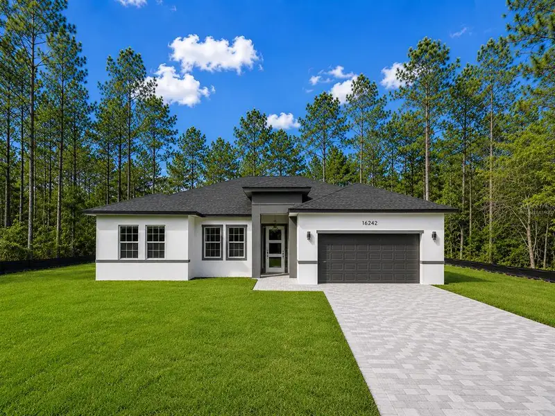Front exterior of a new home in , Ocala, FL, highlighting curb appeal (Image 20).