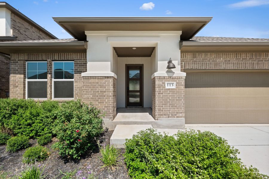 Exterior details and patio area of a home in Lariat, Liberty Hill (Image 3).