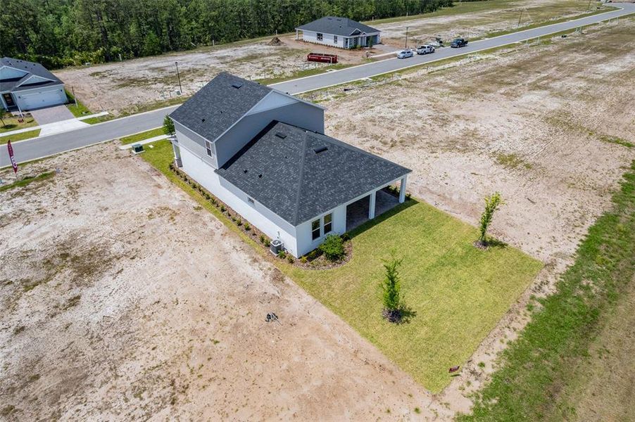 Front exterior of a new home in Gray Hawk at Hole Two, Daytona Beach, FL, highlighting curb appeal (Image 28). Front exterior of a new home in Gray Hawk at Hole Two, Daytona Beach, FL, highlighting curb appeal (Image 28).