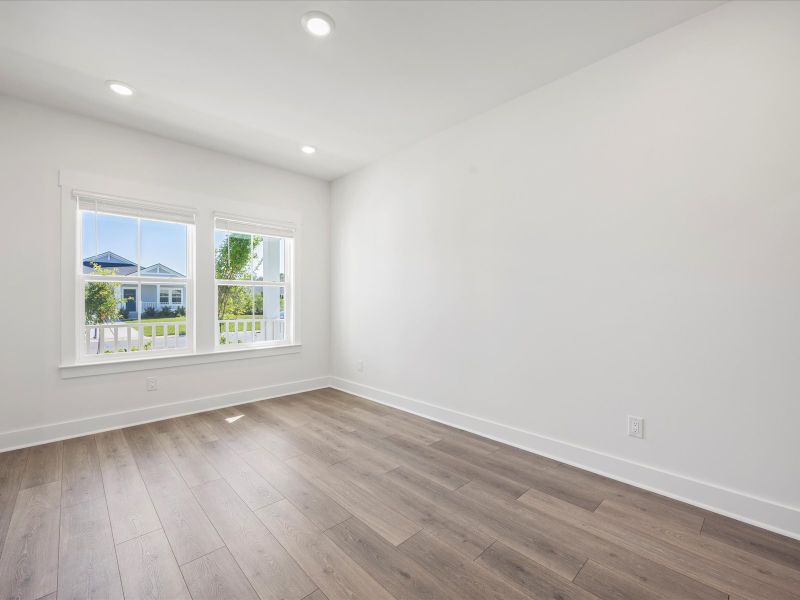 Spacious, unfurnished interior of a new home in The Coves at Lakes of Cane Bay, Summerville (Image 15).