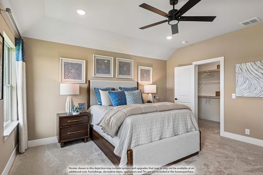Master bedroom with vaulted ceiling, ceiling fan, carpet flooring, and walk-in closet doorway visible. Master bedroom with vaulted ceiling, ceiling fan, carpet flooring, and walk-in closet doorway visible.