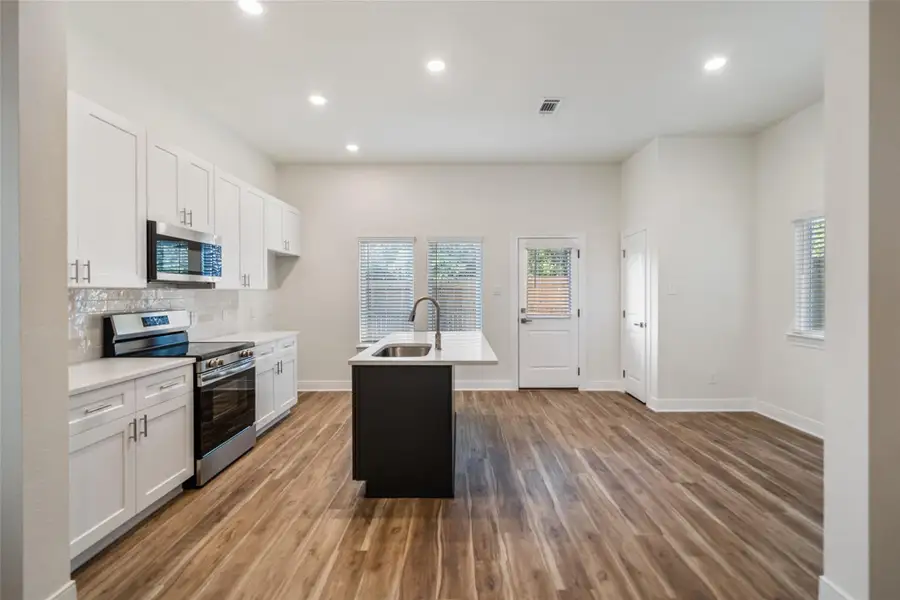 View of kitchen from living area. View of kitchen from living area.