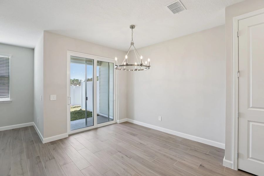 Sun-filled dining space with easy access to back patio