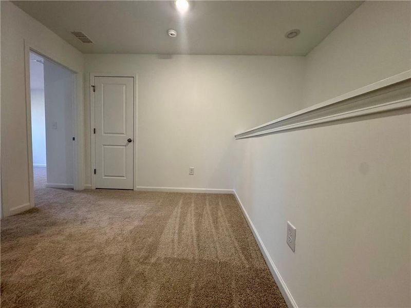 Spacious, unfurnished interior of a new home in Eastlyn Crossing, Flowery Branch (Image 29).