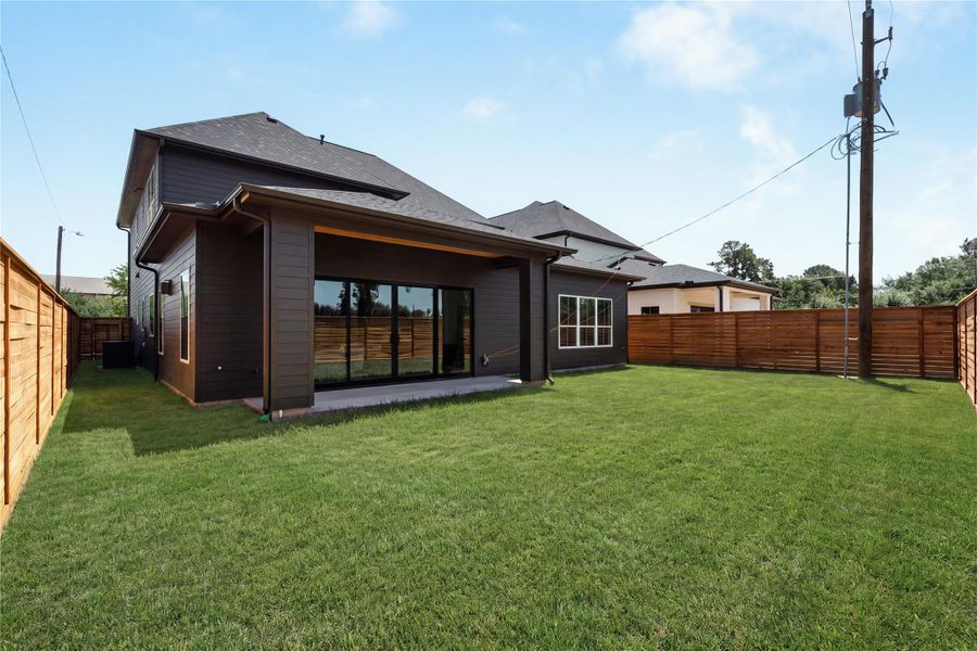 The oversized 30' x 60' backyard offers exceptional space for a future pool, play lawn, or custom outdoor retreat, all enclosed by a 7-foot cedar privacy fence.