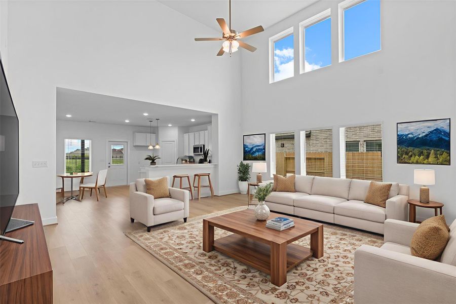 The open-concept family room is a showstopper with its towering ceilings, large windows that flood the space with natural light, and expansive layout—ideal for entertaining or everyday living. **Image Representative of Plan Only and May Vary as Built**. The open-concept family room is a showstopper with its towering ceilings, large windows that flood the space with natural light, and expansive layout—ideal for entertaining or everyday living. **Image Representative of Plan Only and May Vary as Built**.