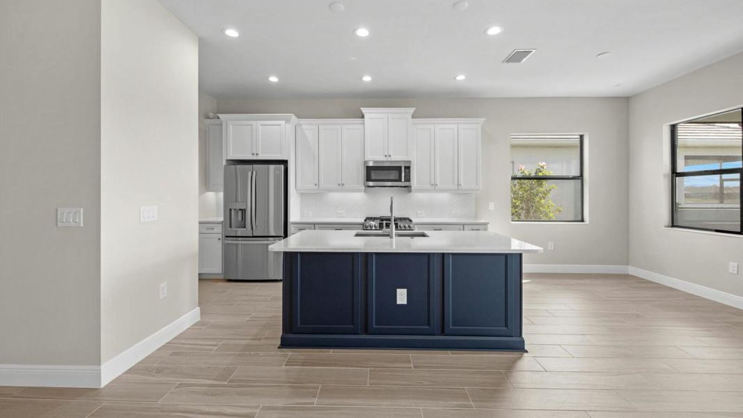 Furnished interior view inside a new home in SkySail Real Estate and Homes for Sale in Naples, FL - Neal Communities, Naples (Image 6).