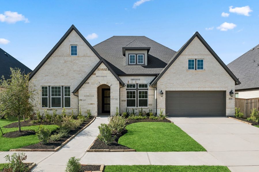 Front exterior of a new home in Sienna 65' Homesites, Missouri City, TX, highlighting curb appeal (Image 1).