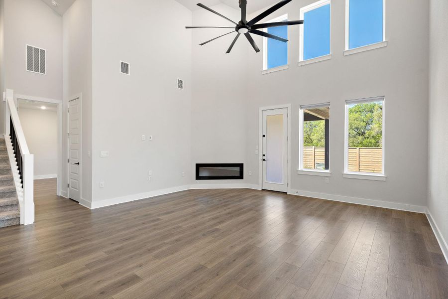 Living room featuring sky-high ceilings