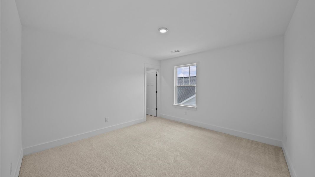 Superior comfort in this light-filled bedroom with plush carpeting and thoughtfully placed large windows Superior comfort in this light-filled bedroom with plush carpeting and thoughtfully placed large windows