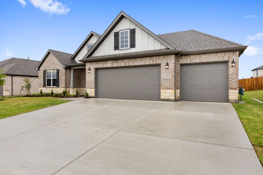 Front exterior of a new home in Waverly Estates, Nevada, TX, highlighting curb appeal (Image 46).