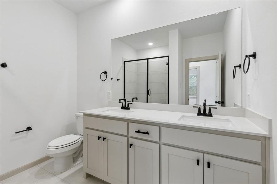 Friends and family will feel right at home in either of the beautifully finished guest baths in our Giselle plan.