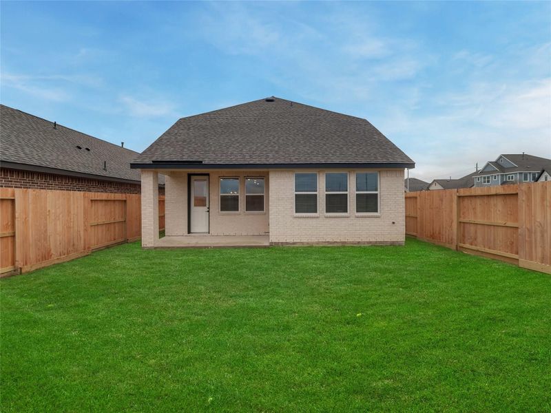 Exterior details and patio area of a home in Oakberry Trails, Waller (Image 25).
