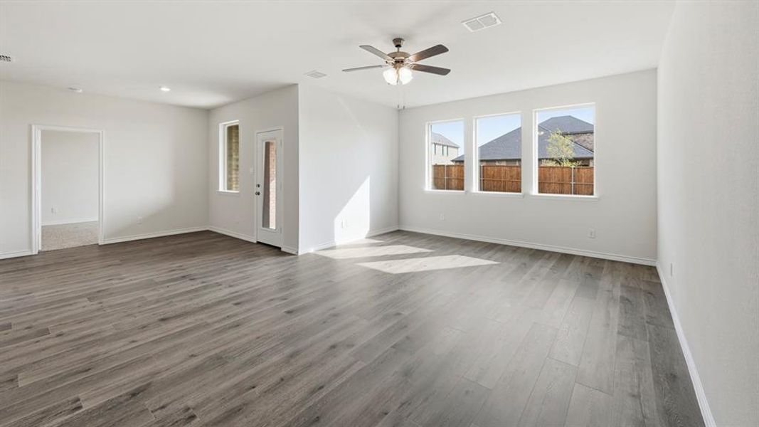 Unfurnished room featuring light wood finished floors, ceiling fan, and recessed lighting