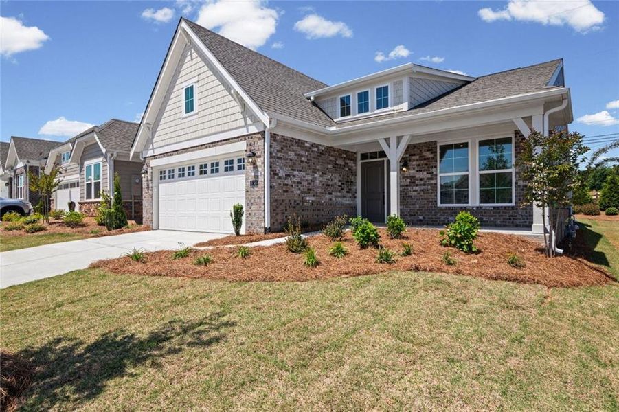 Front exterior of a new home in Laurel Farms, Dallas, GA, highlighting curb appeal (Image 19). Front exterior of a new home in Laurel Farms, Dallas, GA, highlighting curb appeal (Image 19).