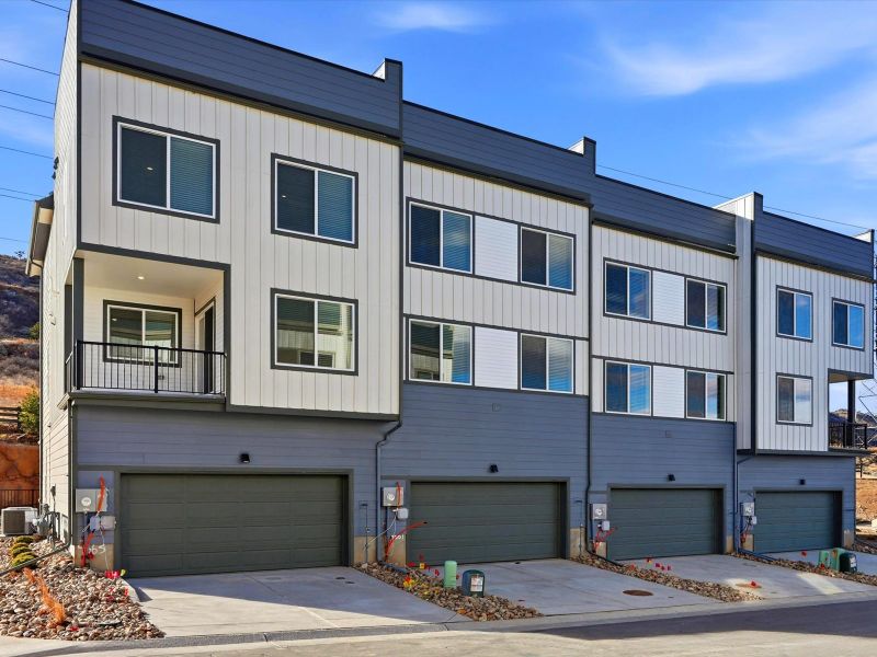 Front exterior of a new home in Three Hills, Morrison, CO, highlighting curb appeal (Image 1). Front exterior of a new home in Three Hills, Morrison, CO, highlighting curb appeal (Image 1).