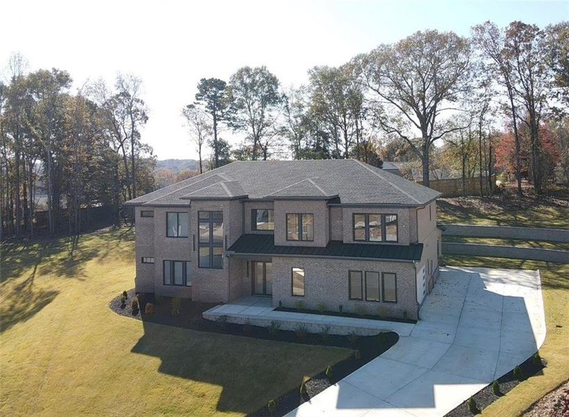 Front exterior of a new home in , Auburn, GA, highlighting curb appeal (Image 1). Front exterior of a new home in , Auburn, GA, highlighting curb appeal (Image 1).