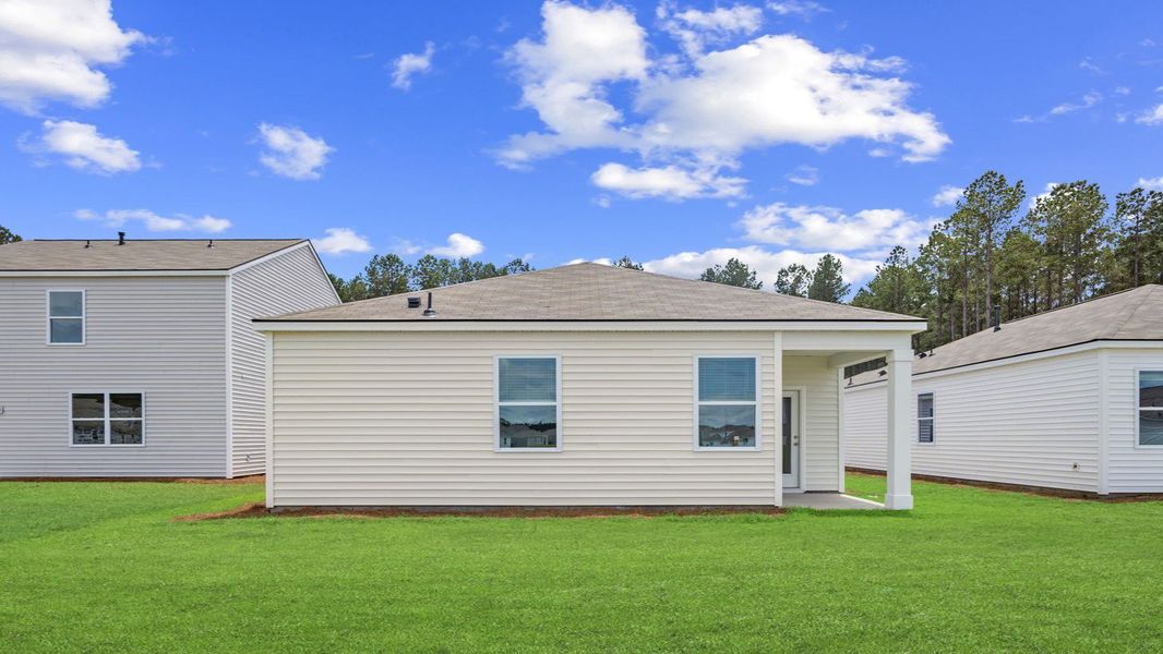 Front exterior of a new home in The Retreat at East Argent, Ridgeland, SC, highlighting curb appeal (Image 22). Front exterior of a new home in The Retreat at East Argent, Ridgeland, SC, highlighting curb appeal (Image 22).