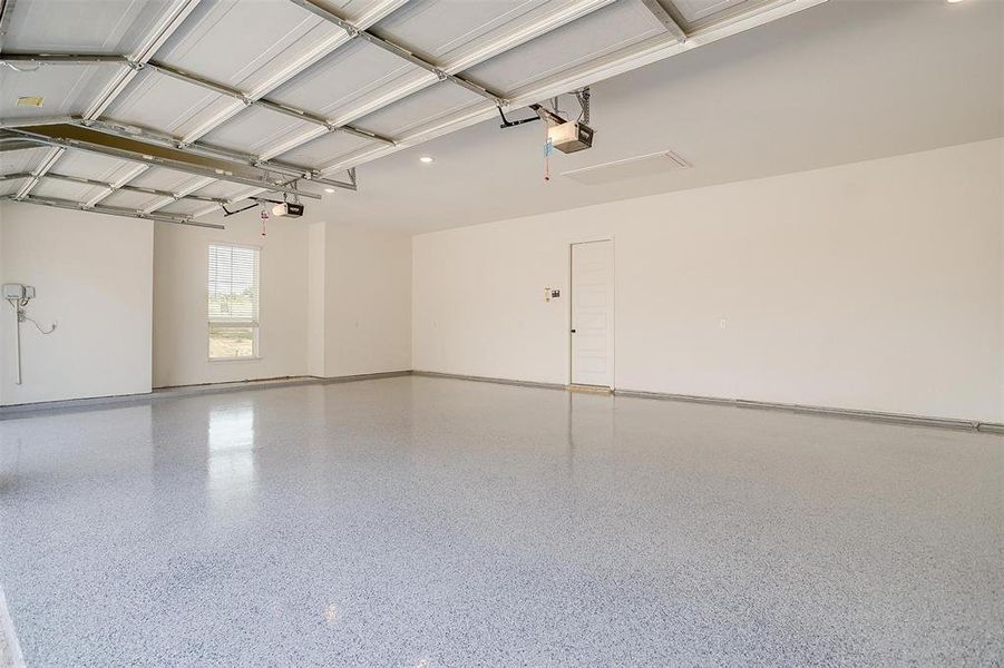 3 car garage with epoxy flooring