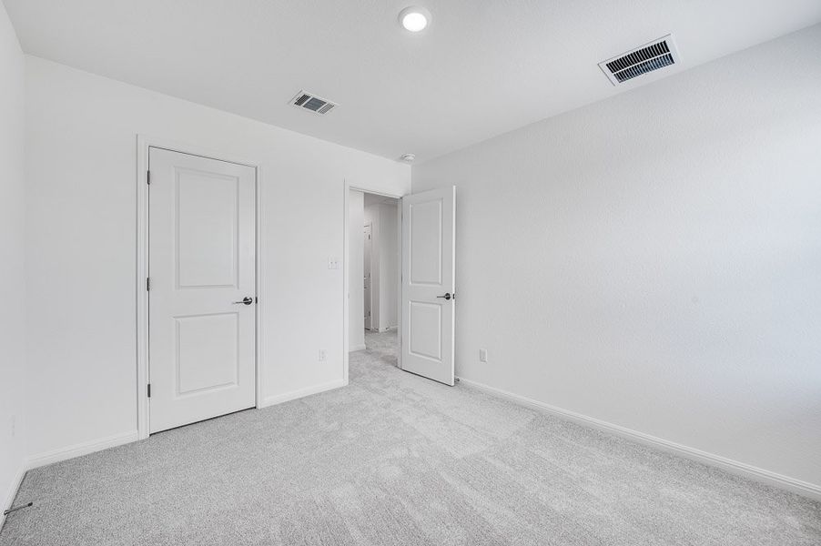Representative unfurnished interior of a home built from the Sparrow by Taylor Morrison in Turner's Crossing 50s, Austin (Image 20).