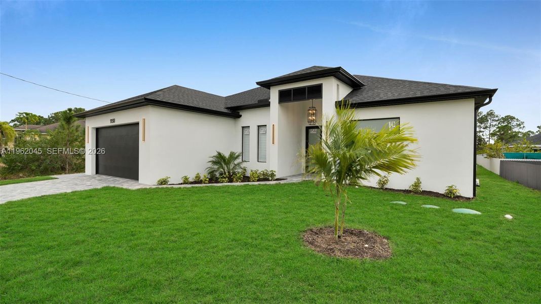 Front exterior of a new home in , Lehigh Acres, FL, highlighting curb appeal (Image 26).