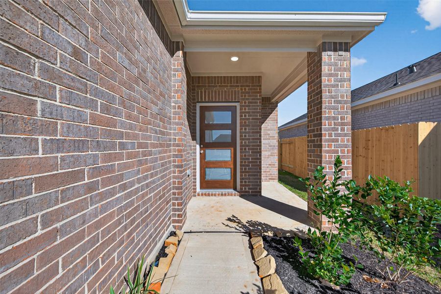 Exterior details and patio area of a home in Enclave at Willis, Willis (Image 3).