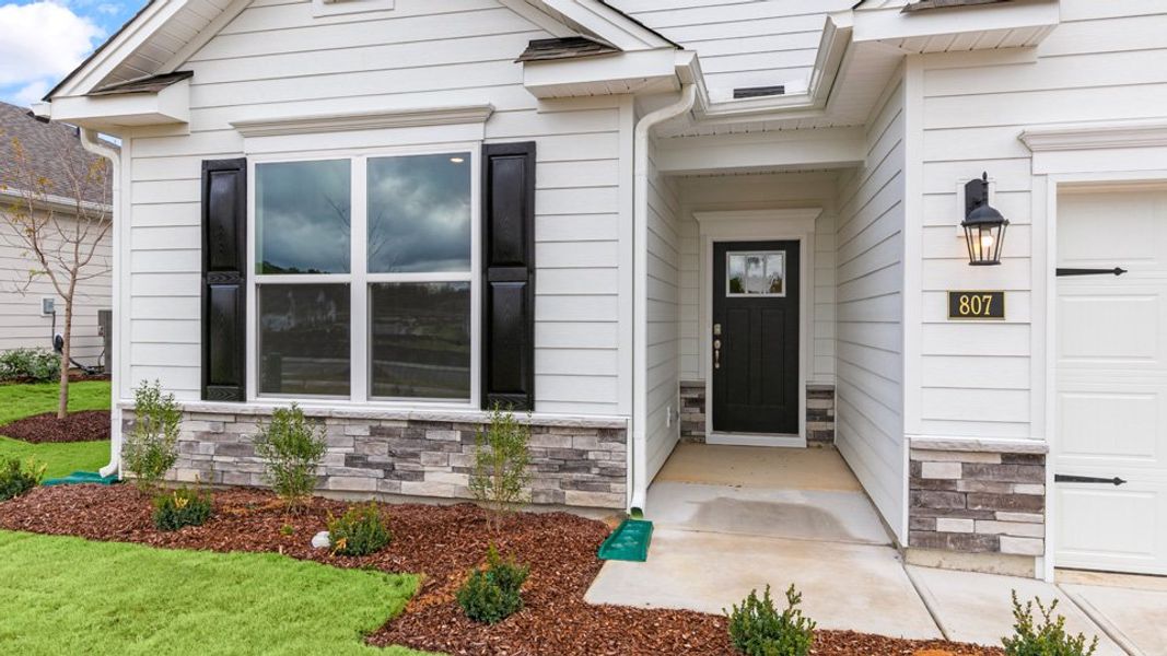 Exterior details and patio area of a home in The Villas at Martin Farms, Aberdeen (Image 3).