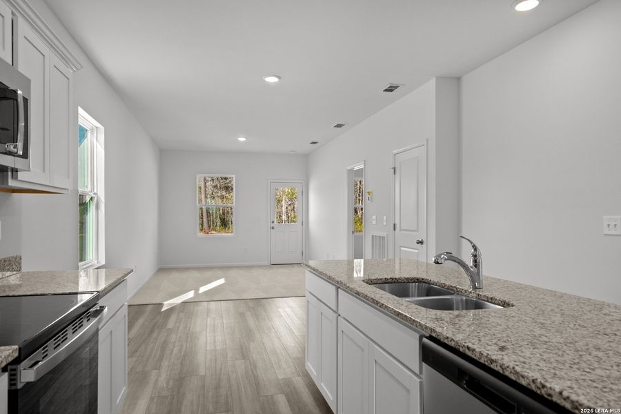 Furnished interior view inside a new home in Sutton Farms, San Antonio (Image 3).