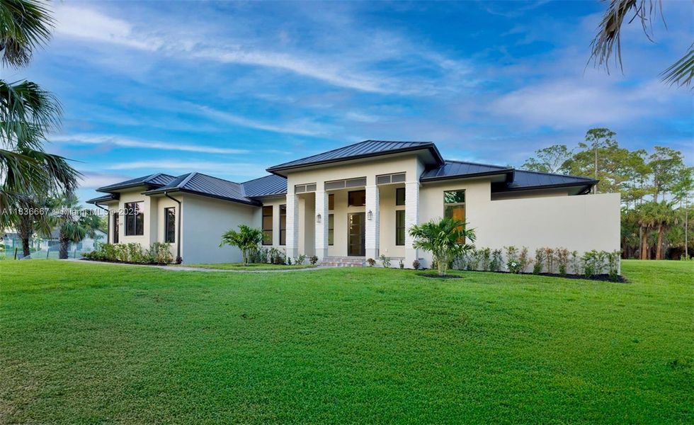 Front exterior of a new home in , Naples, FL, highlighting curb appeal (Image 20).