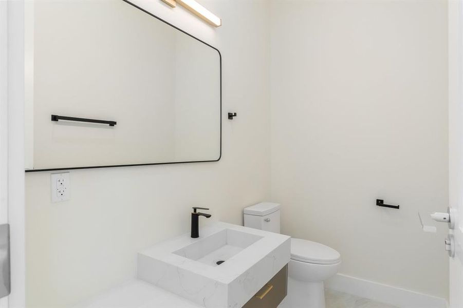 Bathroom featuring vanity and toilet Bathroom featuring vanity and toilet