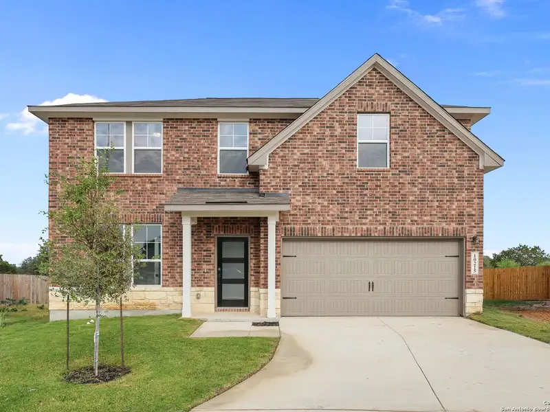 Front exterior of a new home in Royal Crest, San Antonio, TX, highlighting curb appeal (Image 2).