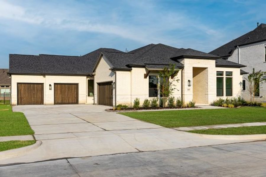 Front exterior of a new home in Heath Golf and Yacht Club, Heath, TX, highlighting curb appeal (Image 28).