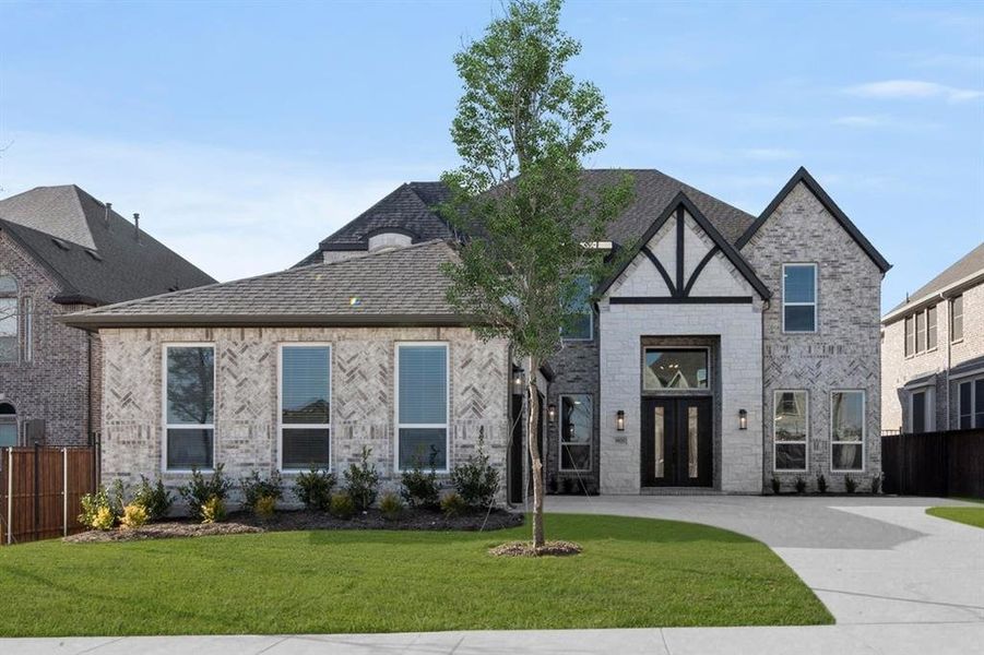 Front exterior of a new home in La Frontera, Fort Worth, TX, highlighting curb appeal (Image 22). Front exterior of a new home in La Frontera, Fort Worth, TX, highlighting curb appeal (Image 22).