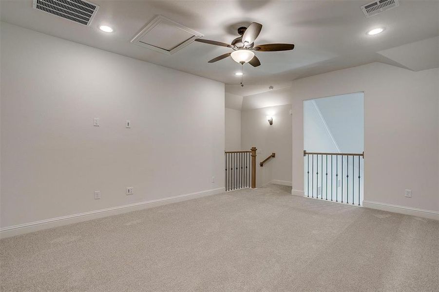 Unfurnished room featuring carpet and ceiling fan